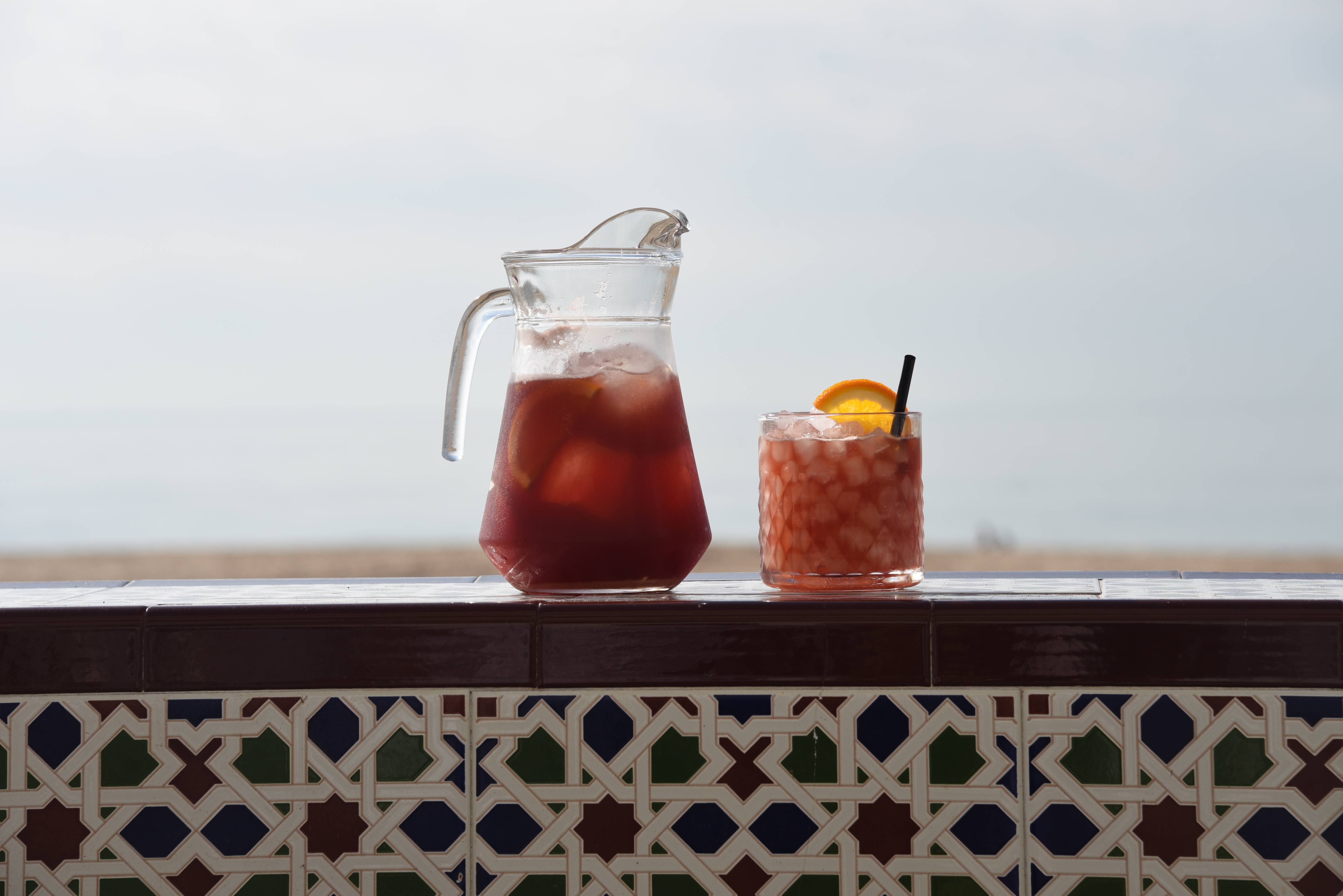 Drinking Sangria at the beach of Spain.